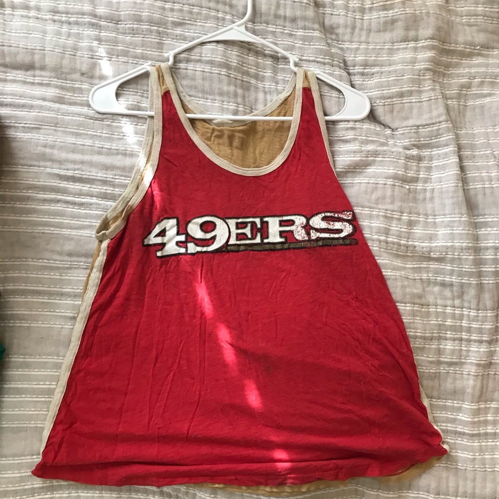 2 Sport Teams tank tops.